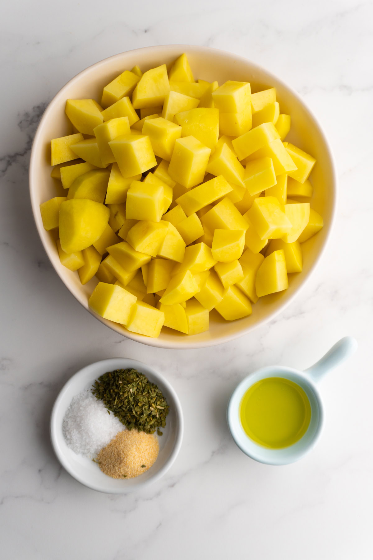 Ingredients needed to make crispy roasted potatoes.