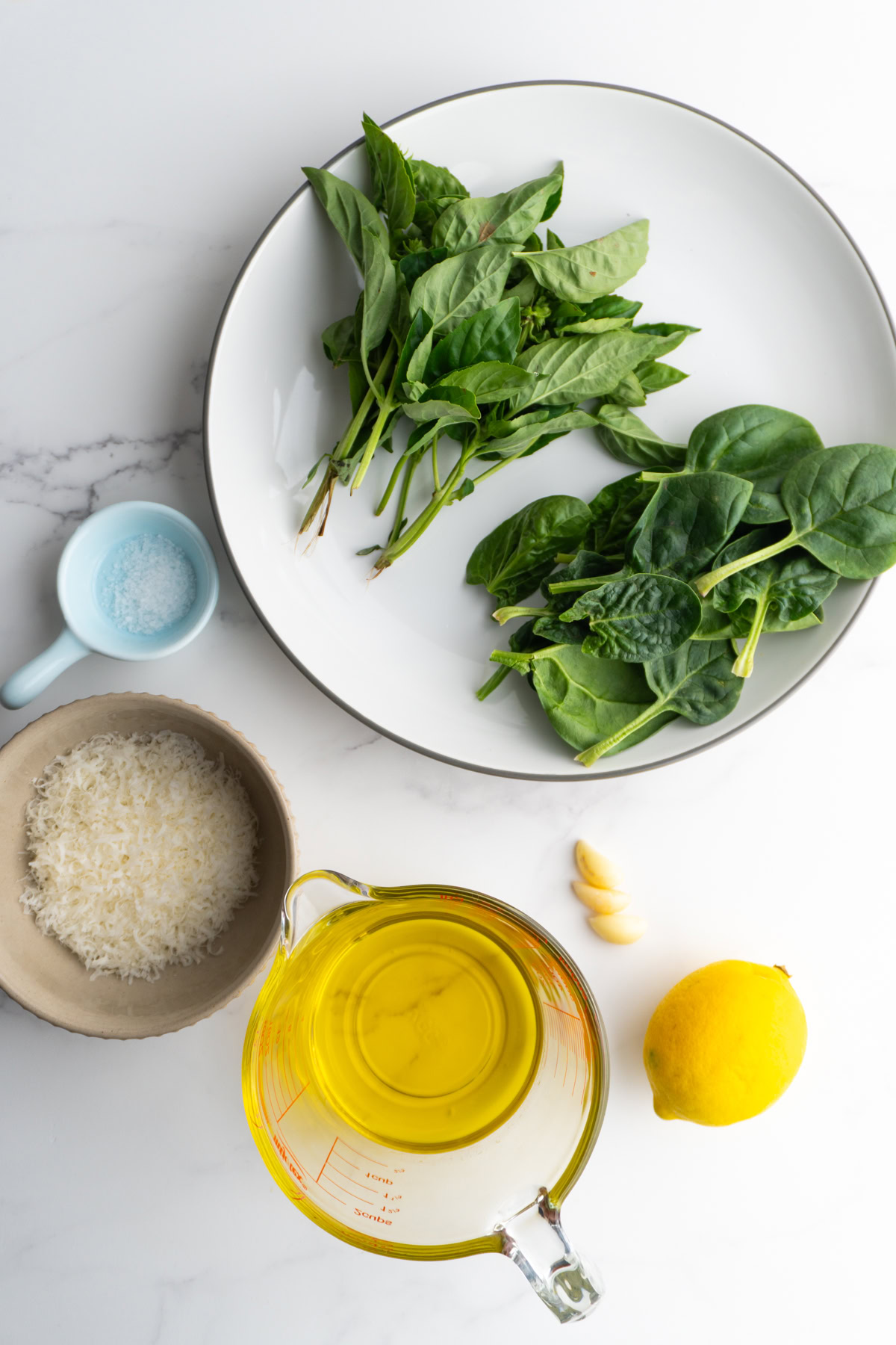 Ingredients needed to make fresh pesto sauce.