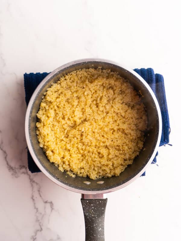 Quinoa in a saucepan after cooking.