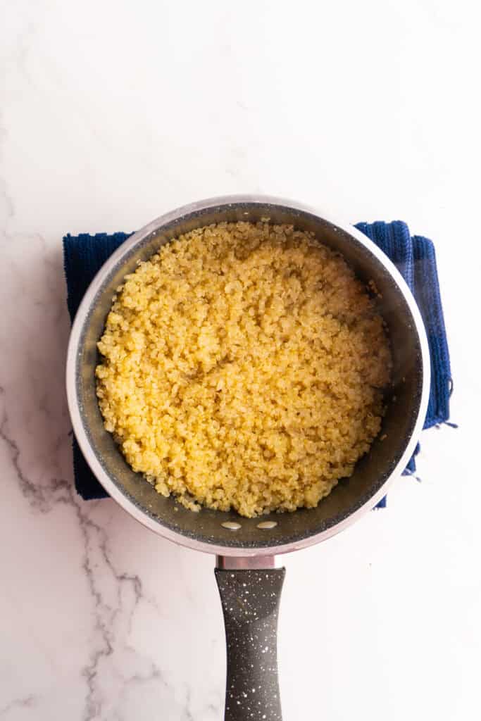Quinoa in a saucepan after cooking.