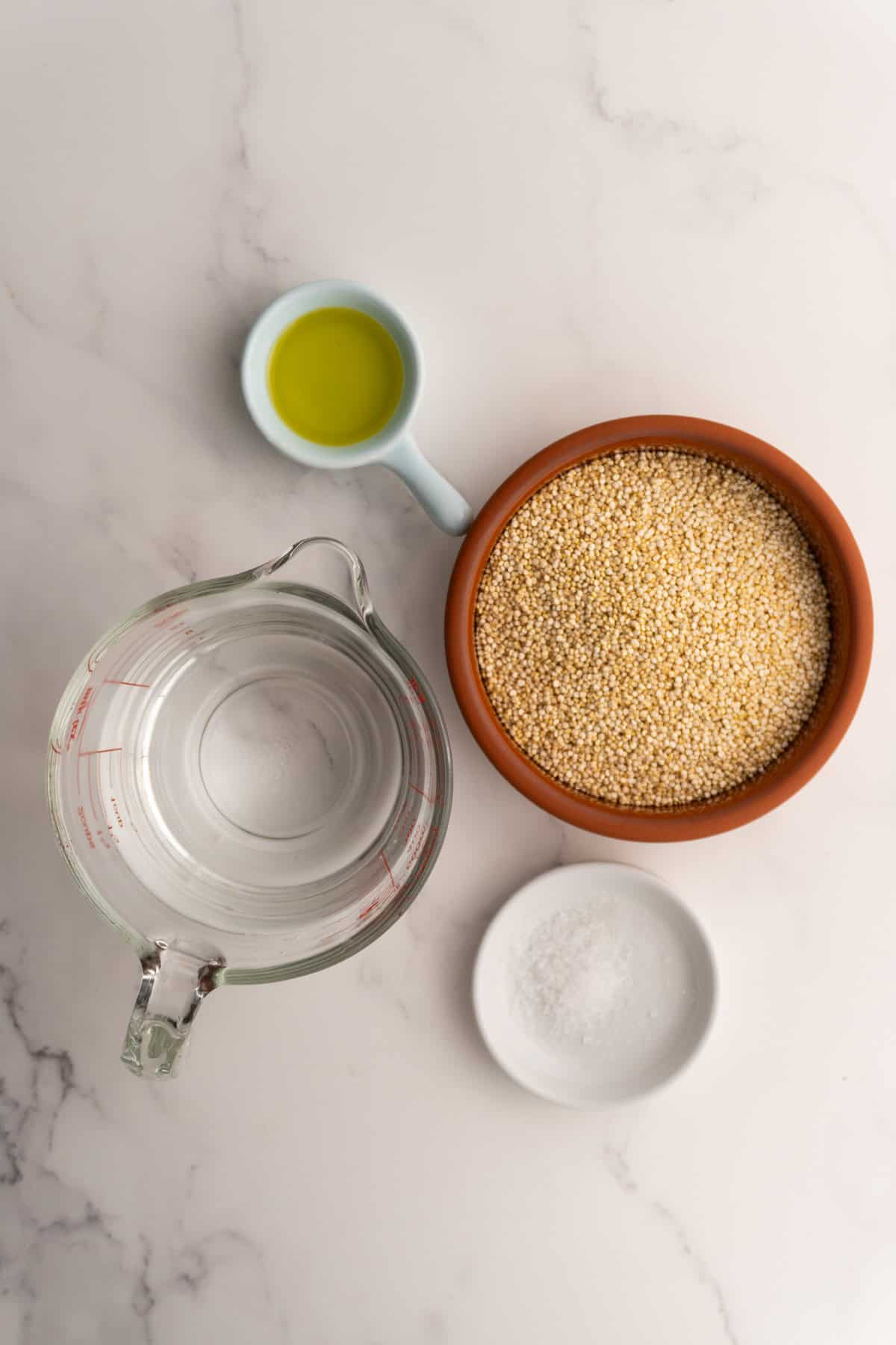 Ingredients needed to cook quinoa on the stove.