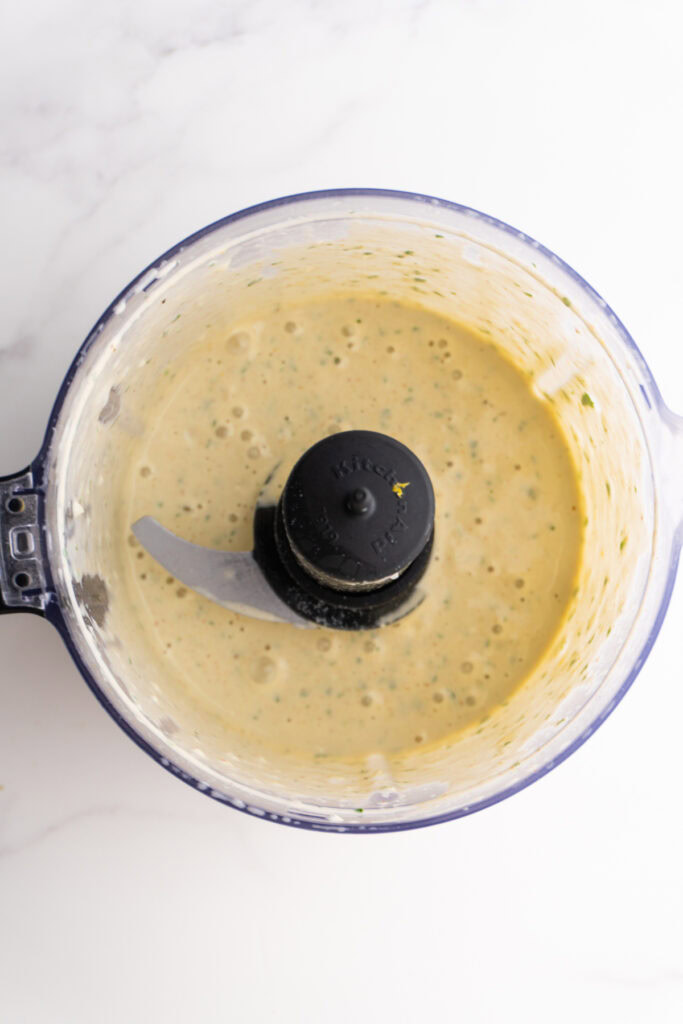 Lemon tahini sauce in the food processor.