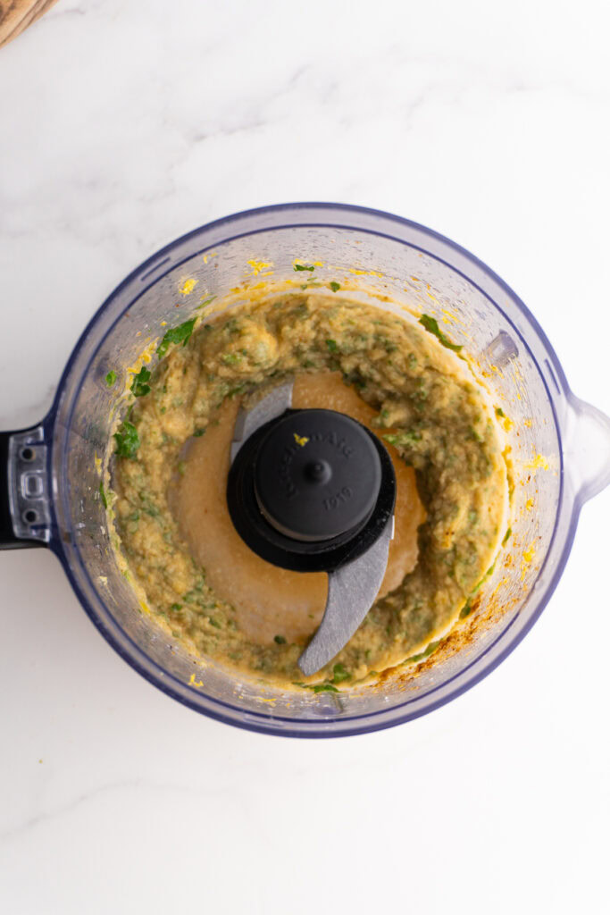 Tahini and other ingredients mixed in food processor before adding water.