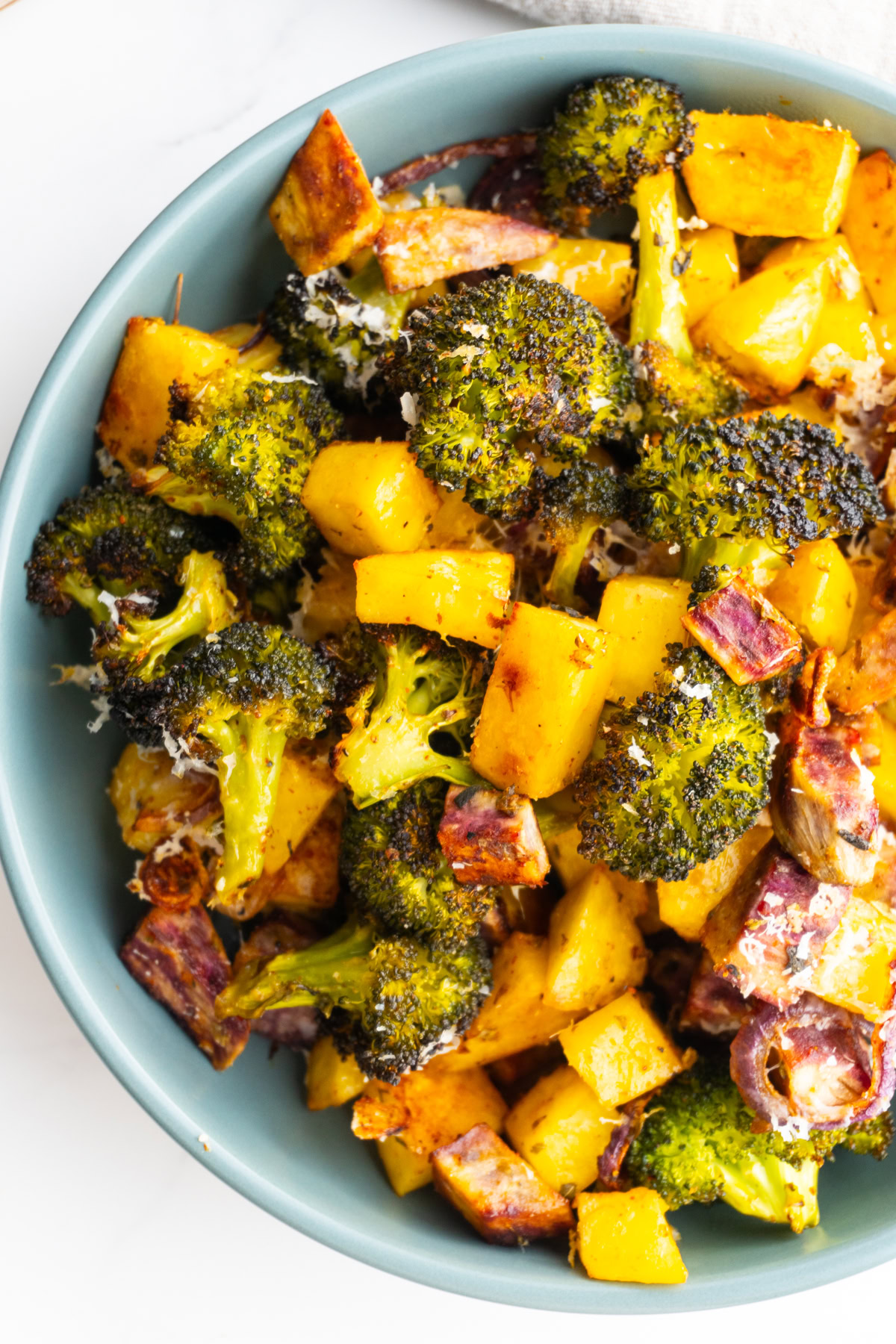 Overhead shot of parmesan roasted veggies in a bowl.