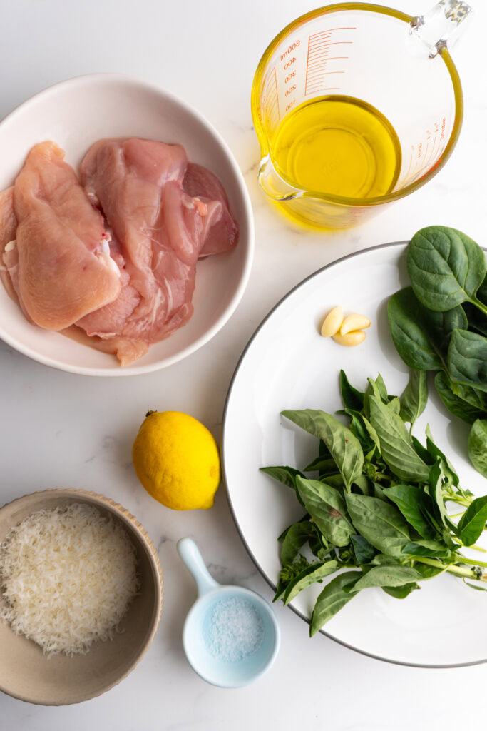 Ingredients needed to make pesto marinated chicken.