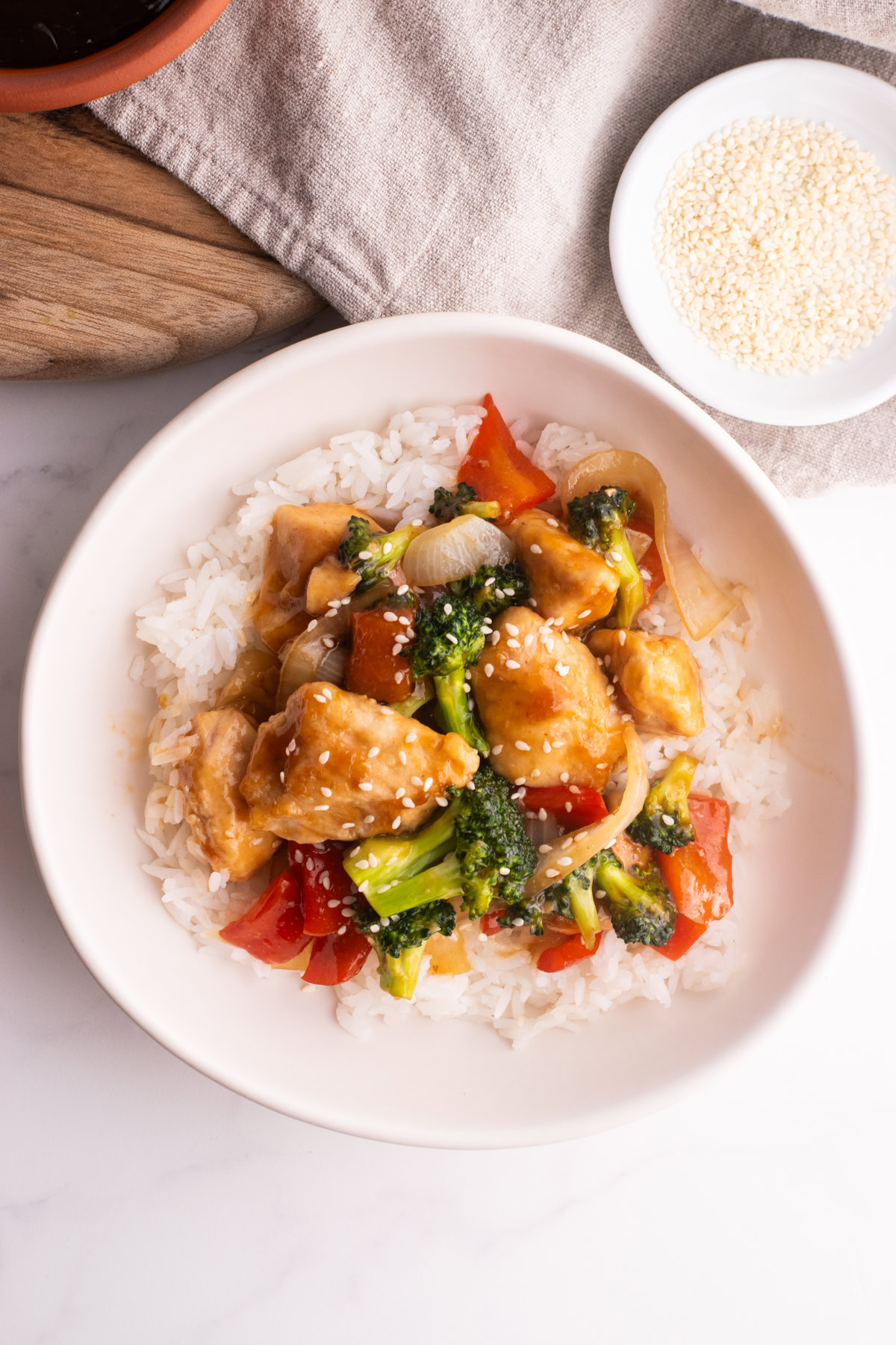 Chicken teriyaki stir fry served on a bed of white rice.