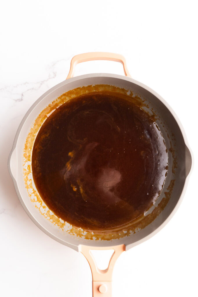 Teriyaki sauce in a skillet.
