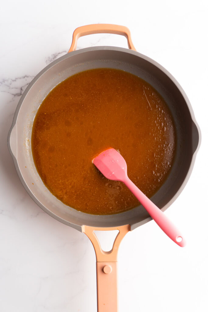 Teriyaki sauce ingredients in a skillet before cooking down.