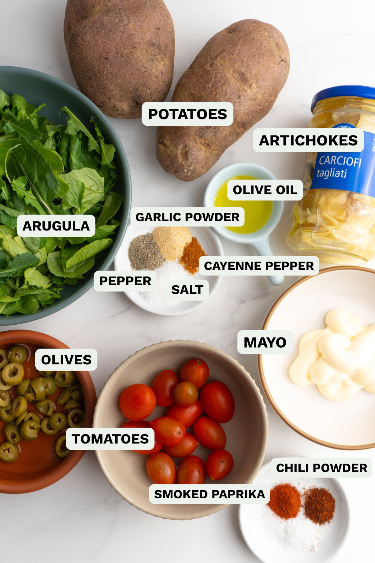 Ingredients needed to make patatas bravas salad bowls.