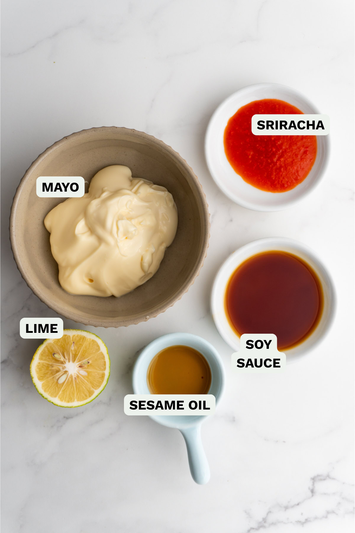 Ingredients needed to make sriracha spicy mayo.