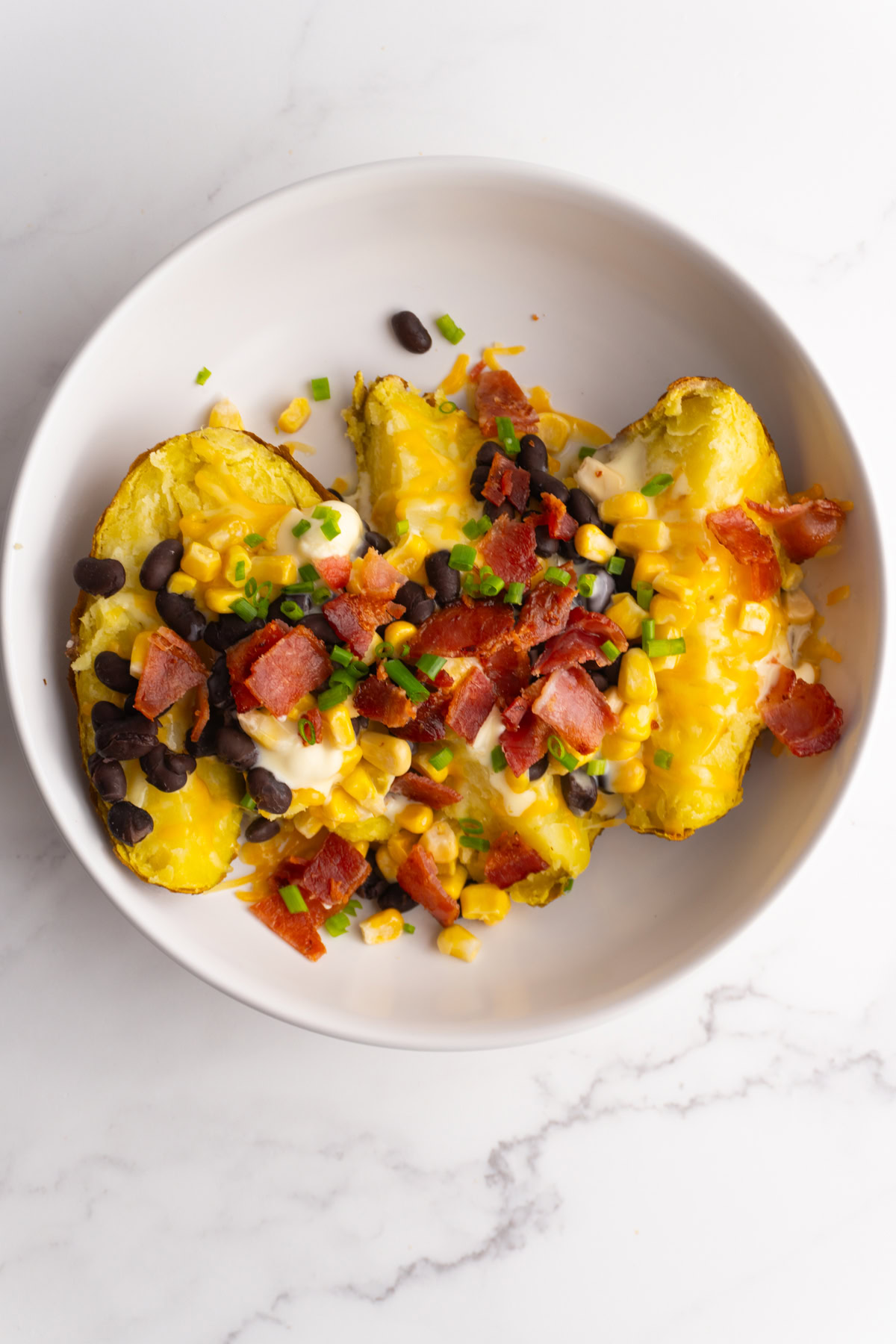 Baked potato with all the toppings on top.