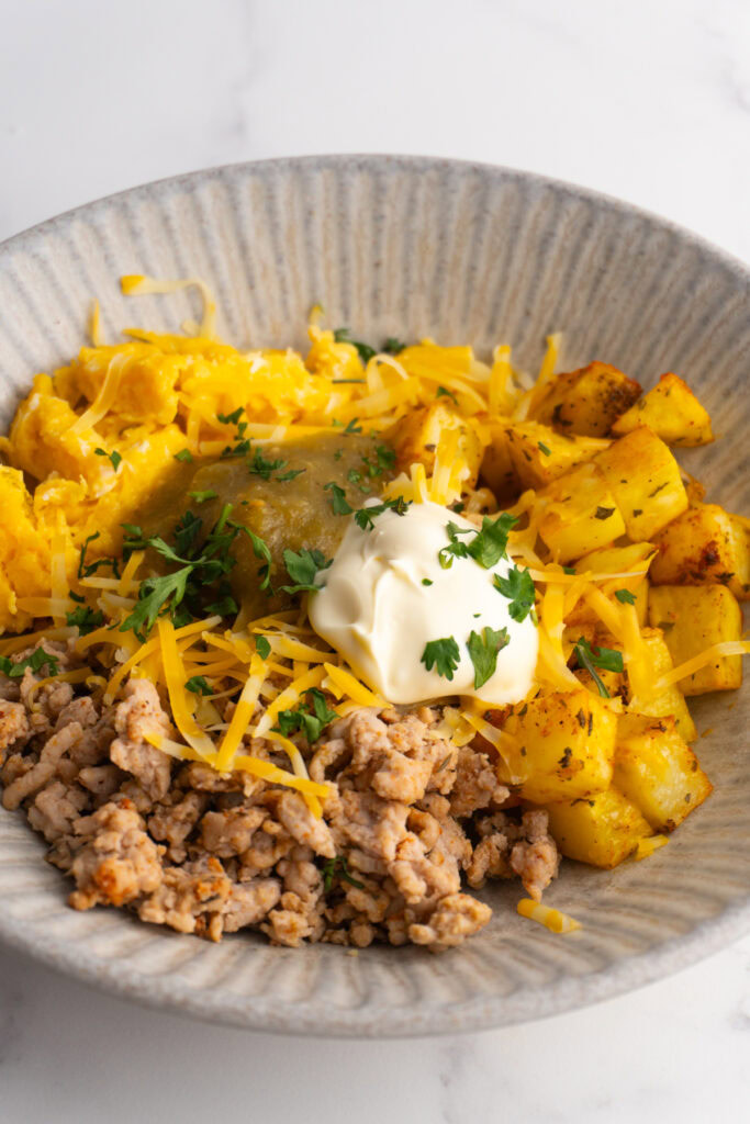 Side view of a breakfast burrito bowl.