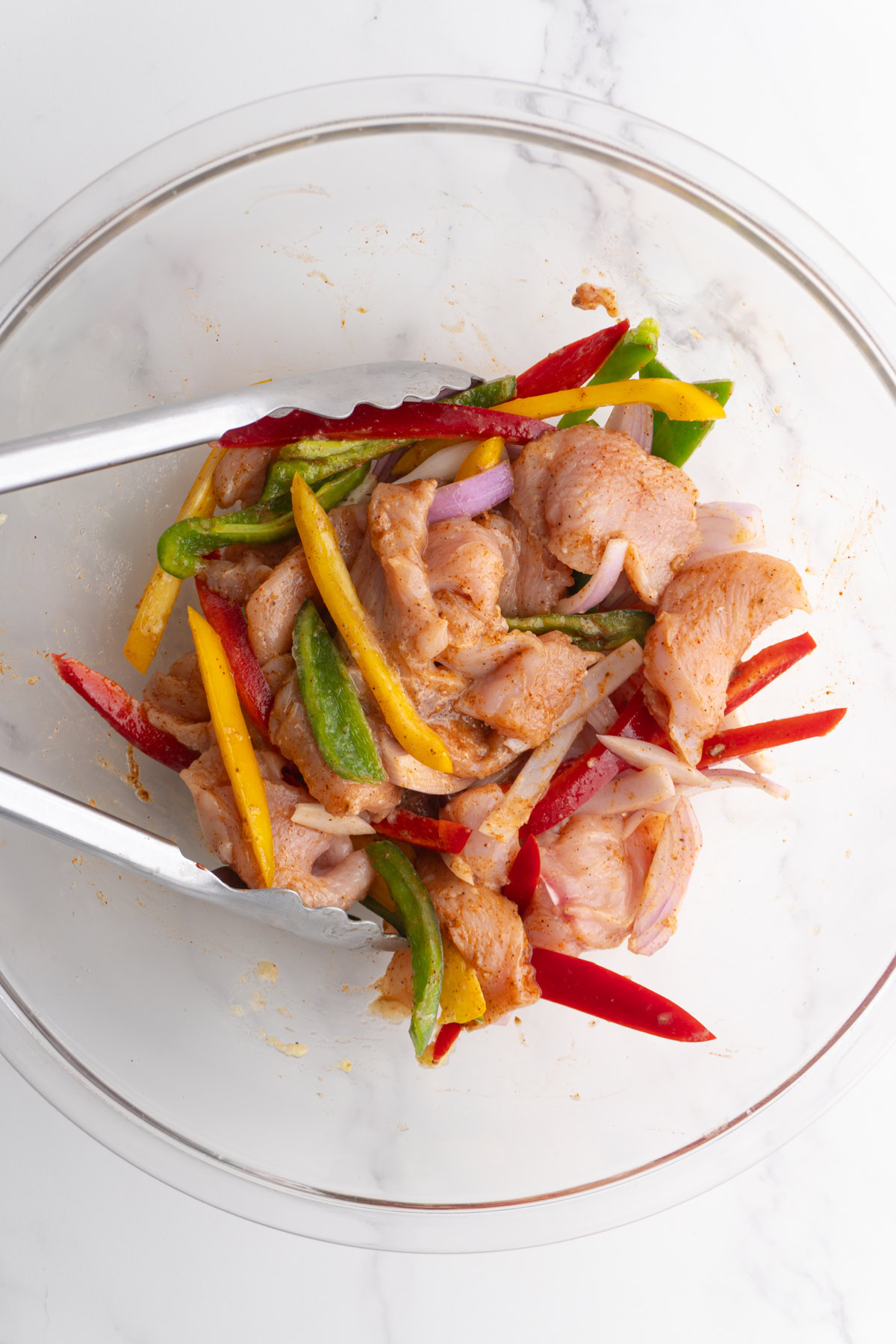 Seasoned chicken and veggies in a bowl.
