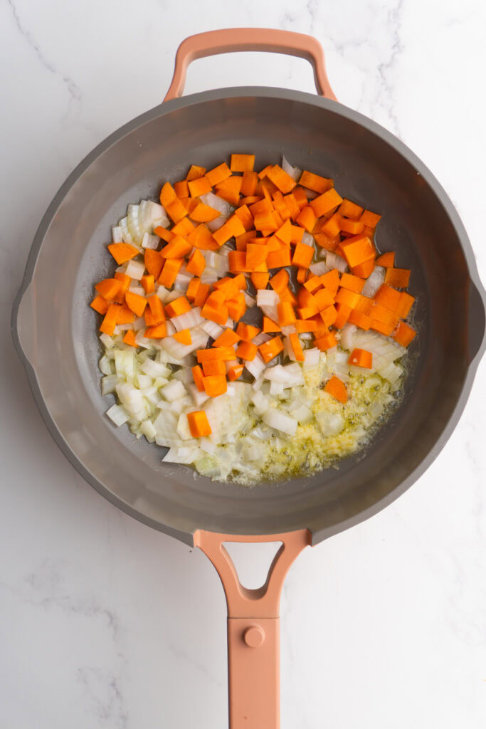 Butter, onions, carrots and garlic in a skillet to sauté.