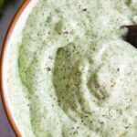 Close up of jalapeño cilantro sauce in a bowl.