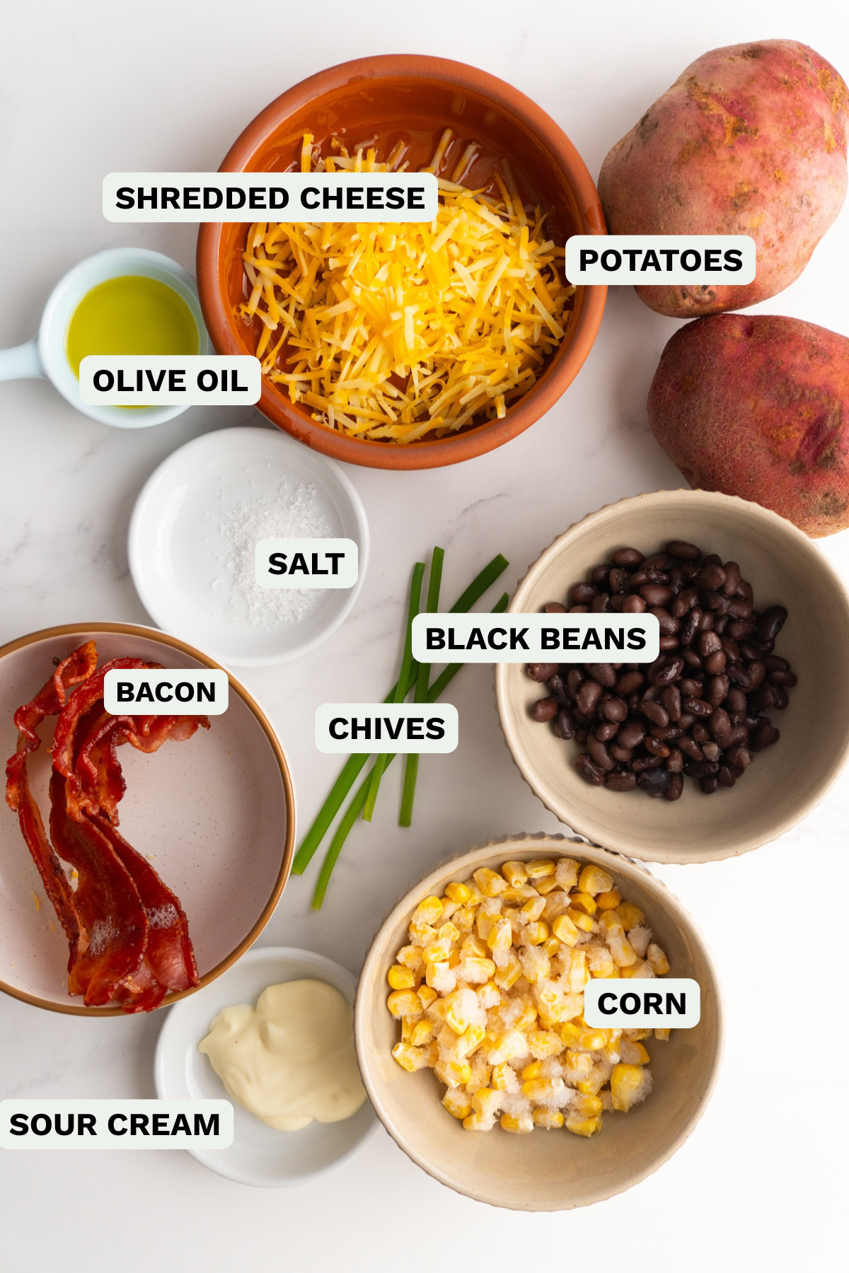 Ingredients needed to make loaded baked potatoes.