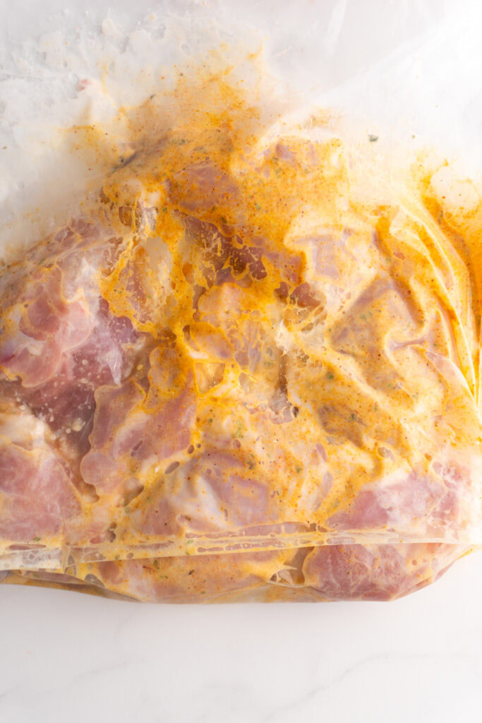 Chicken in the chicken shawarma marinade in a bag.