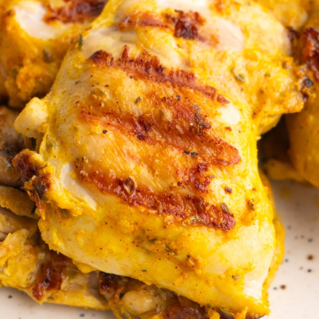 Close up of chicken shawarma chicken with grill marks.