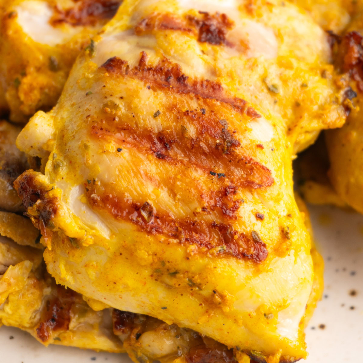 Close up of chicken shawarma chicken with grill marks.