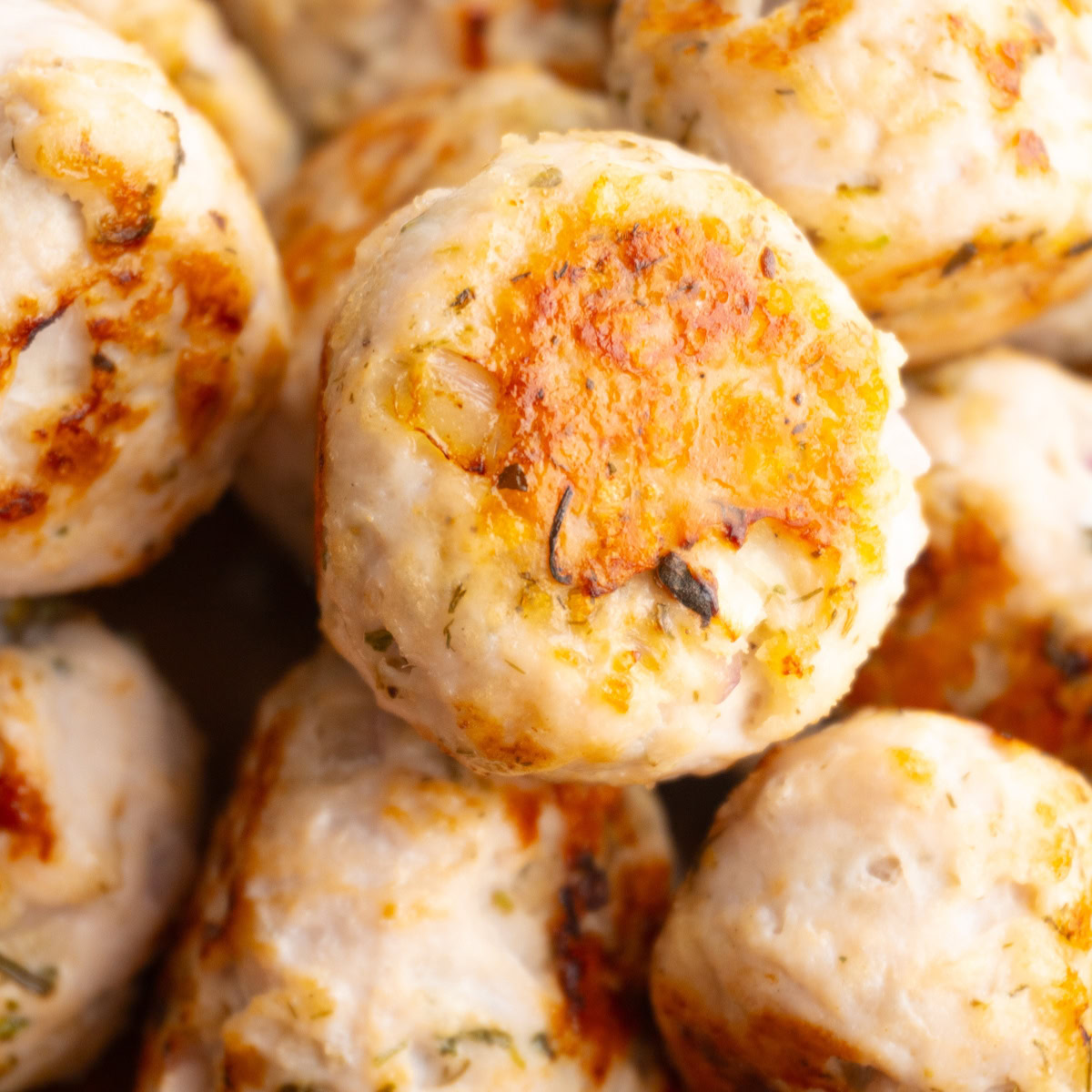 Greek turkey meatballs piled on top of each other.