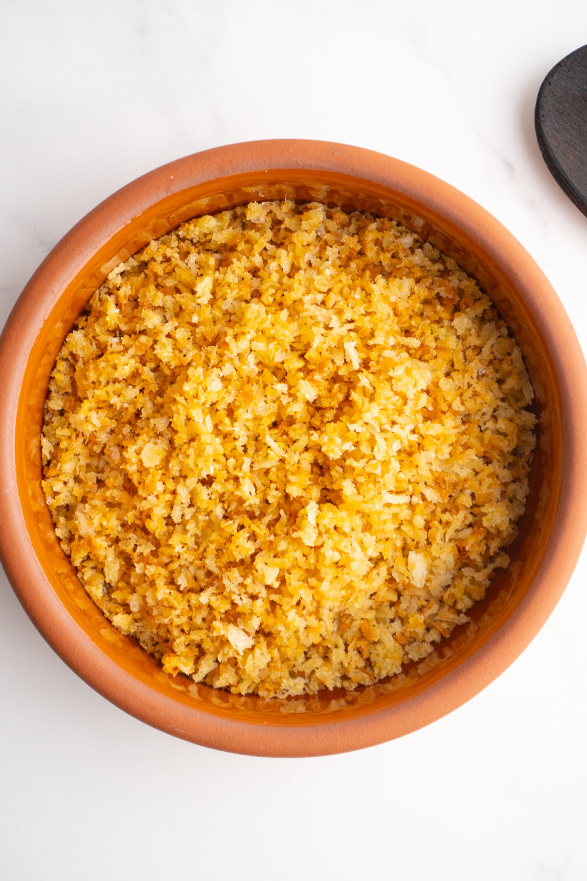 Overhead shot of garlic breadcrumbs in a bowl.