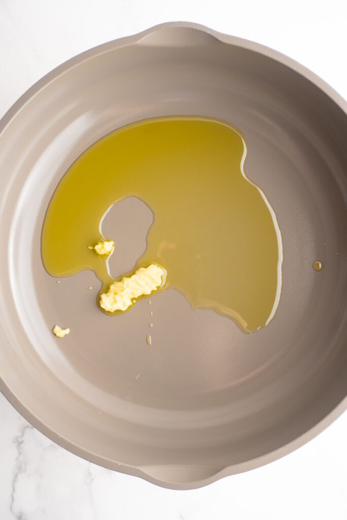 Olive oil and garlic in a skillet.