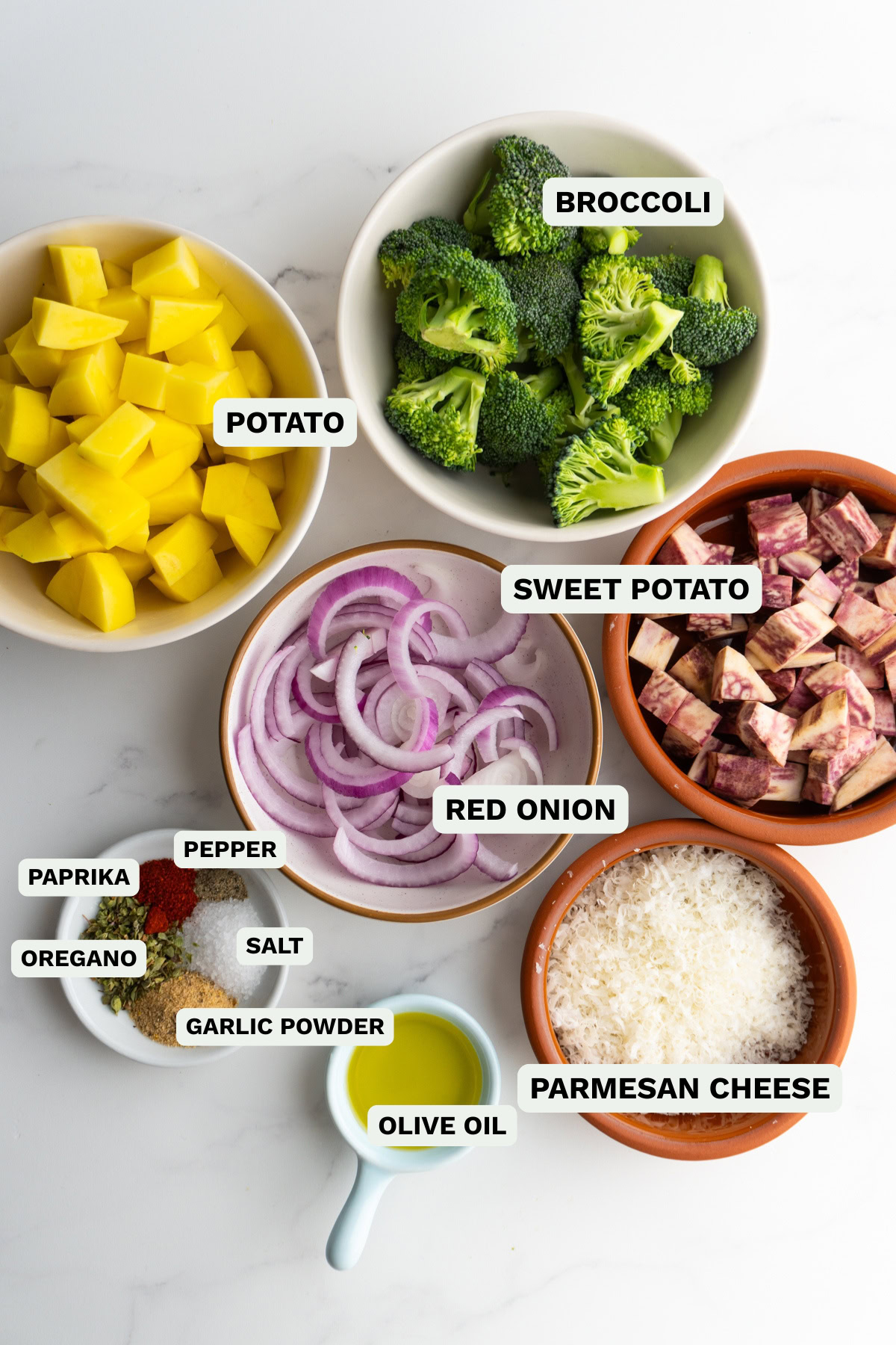 Ingredients needed to make sheet pan roasted vegetables with parmesan.