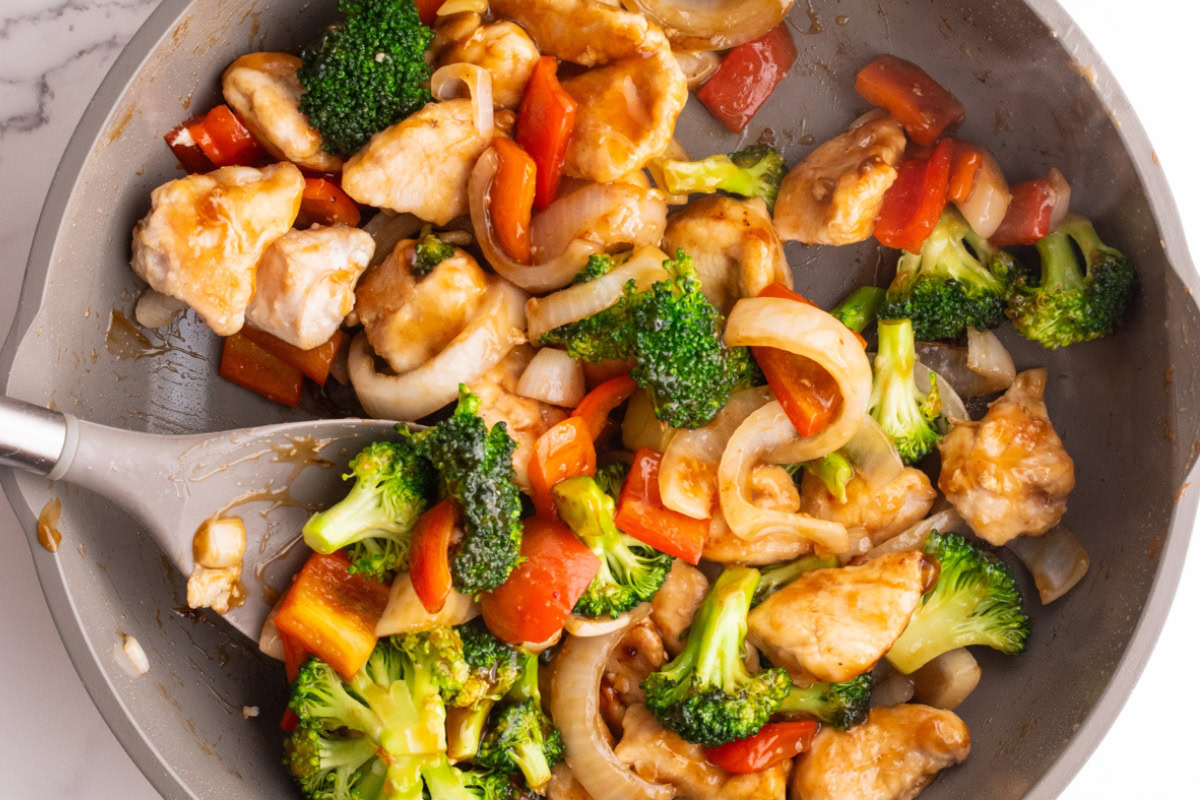 Close up of chicken teriyaki stir fry in a skillet after cooking.