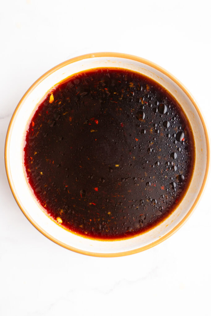 Finished poke bowl sauce in a bowl after being whisked together.