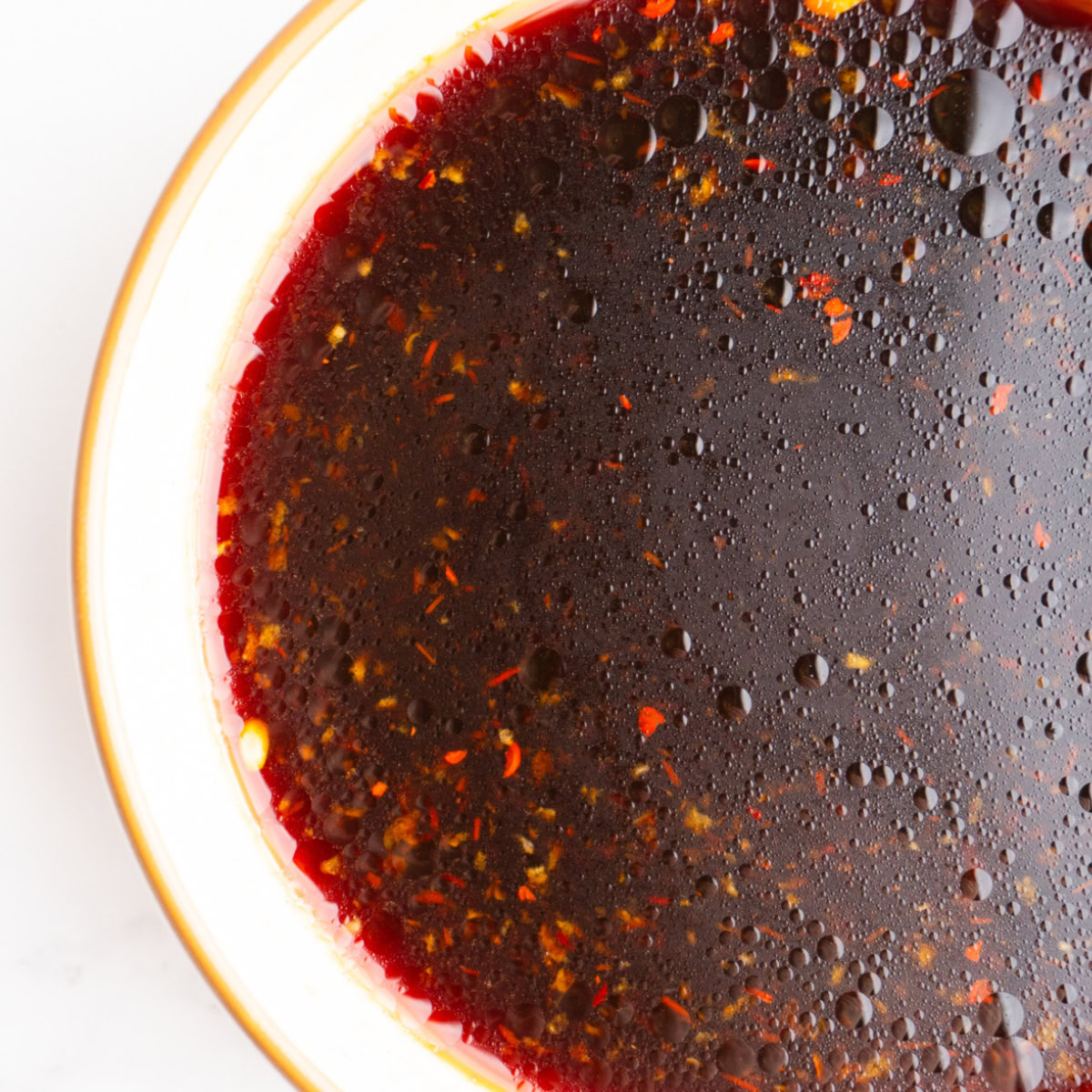 Close up of poke bowl sauce in a bowl.