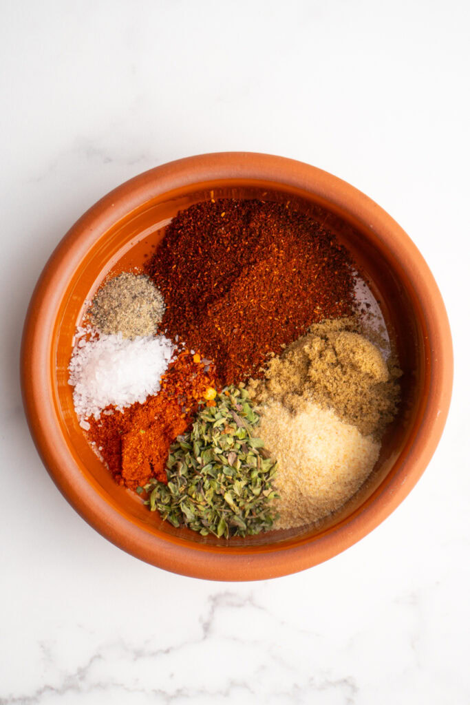 Overhead shot of taco spices in a bowl before being mixed together.