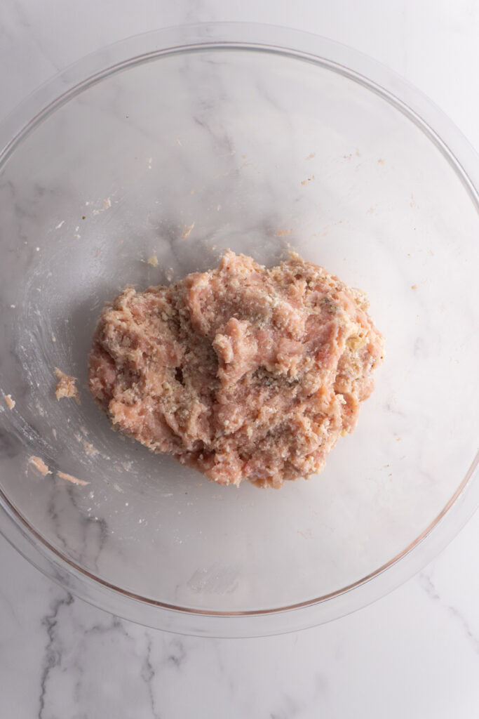 Marry me chicken meatball mixture mixed up in a bowl.