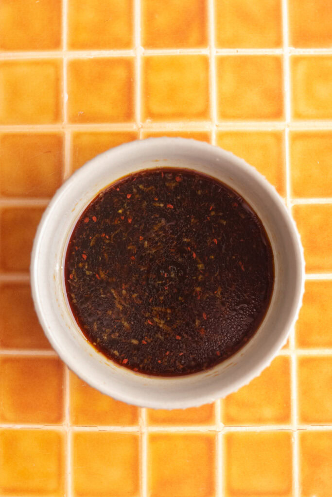 Poke bowl sauce in a small bowl.