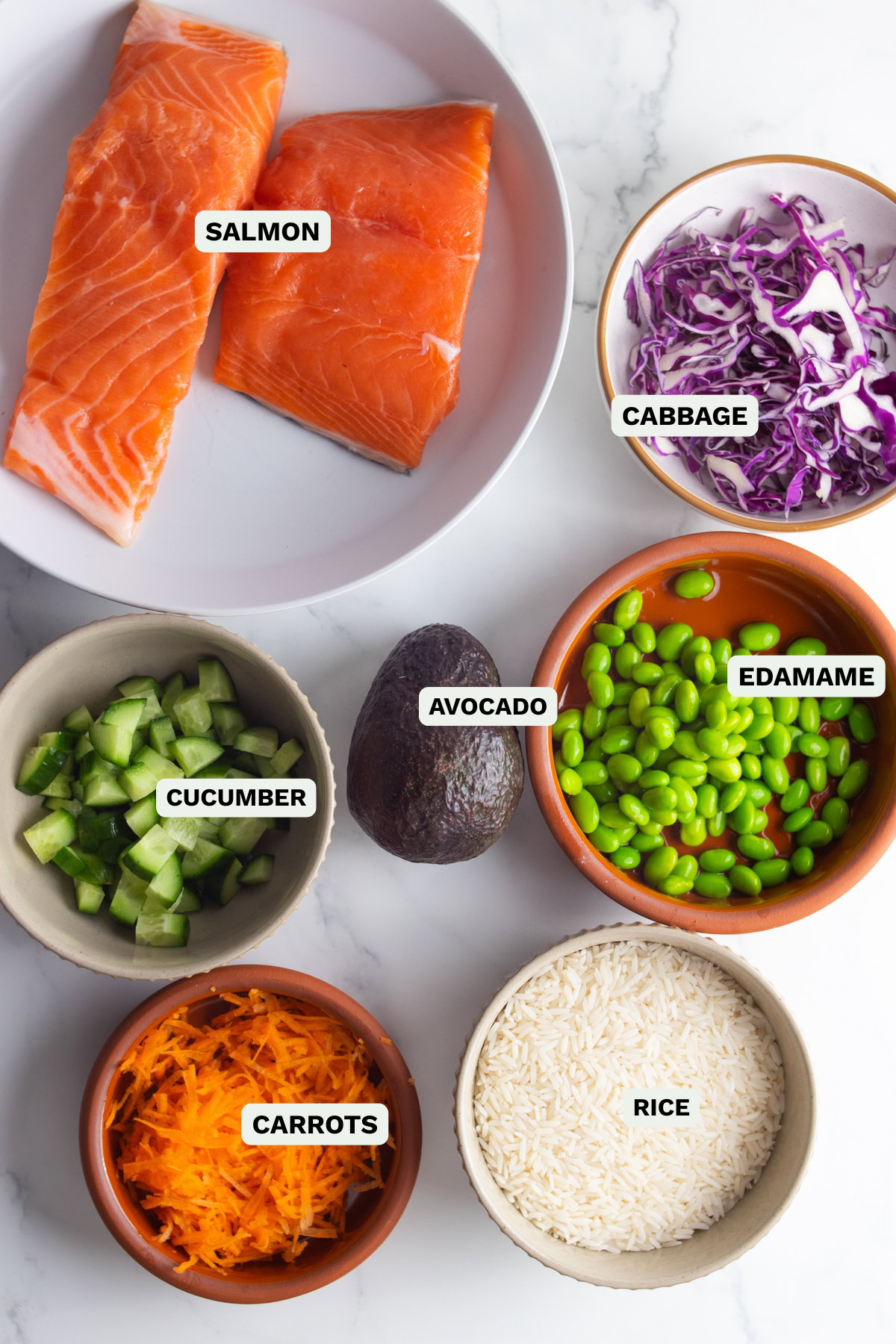 Ingredients needed to make fresh salmon poke bowls.