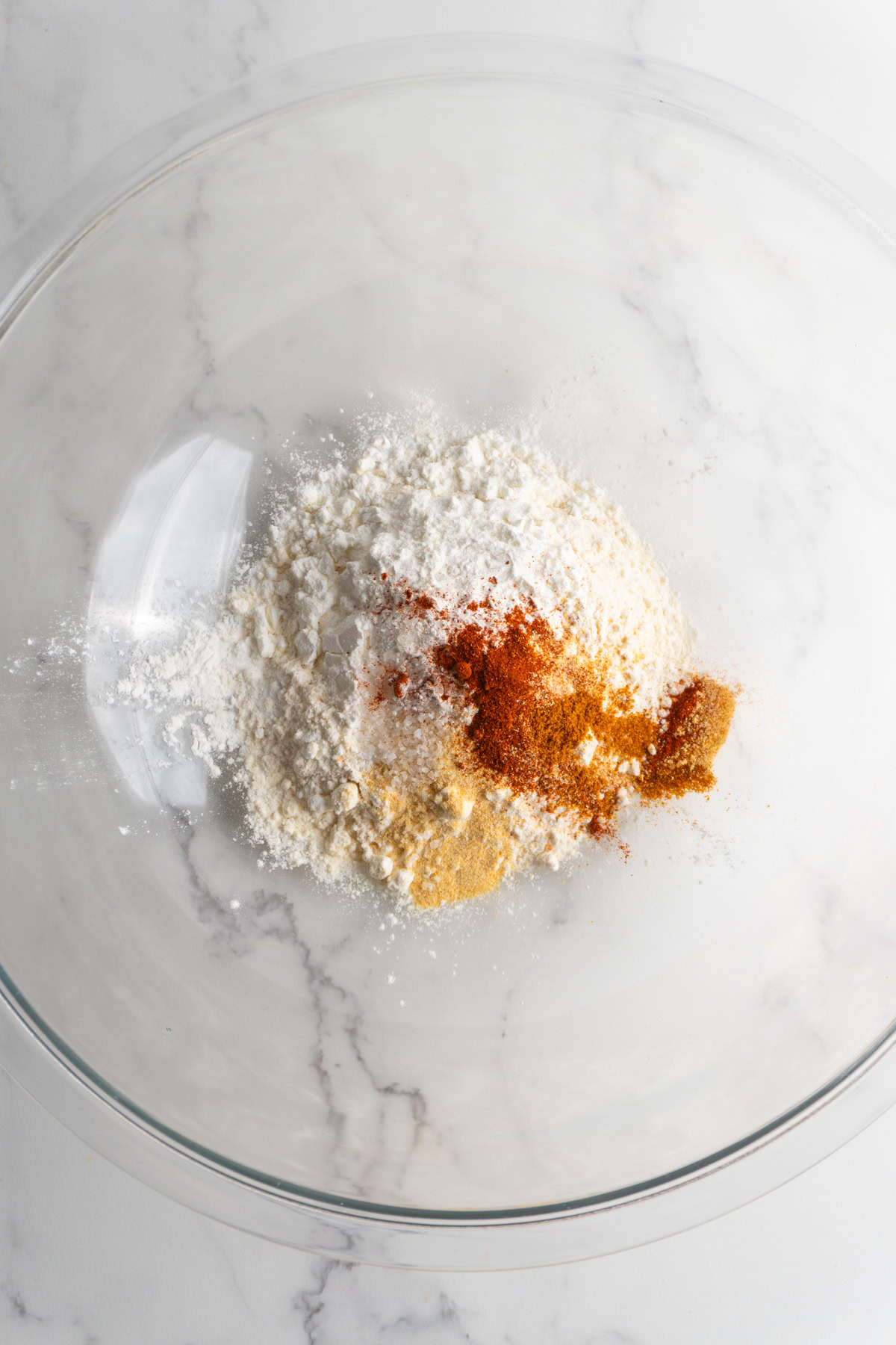 Flour, cornstarch and spices in a bowl.