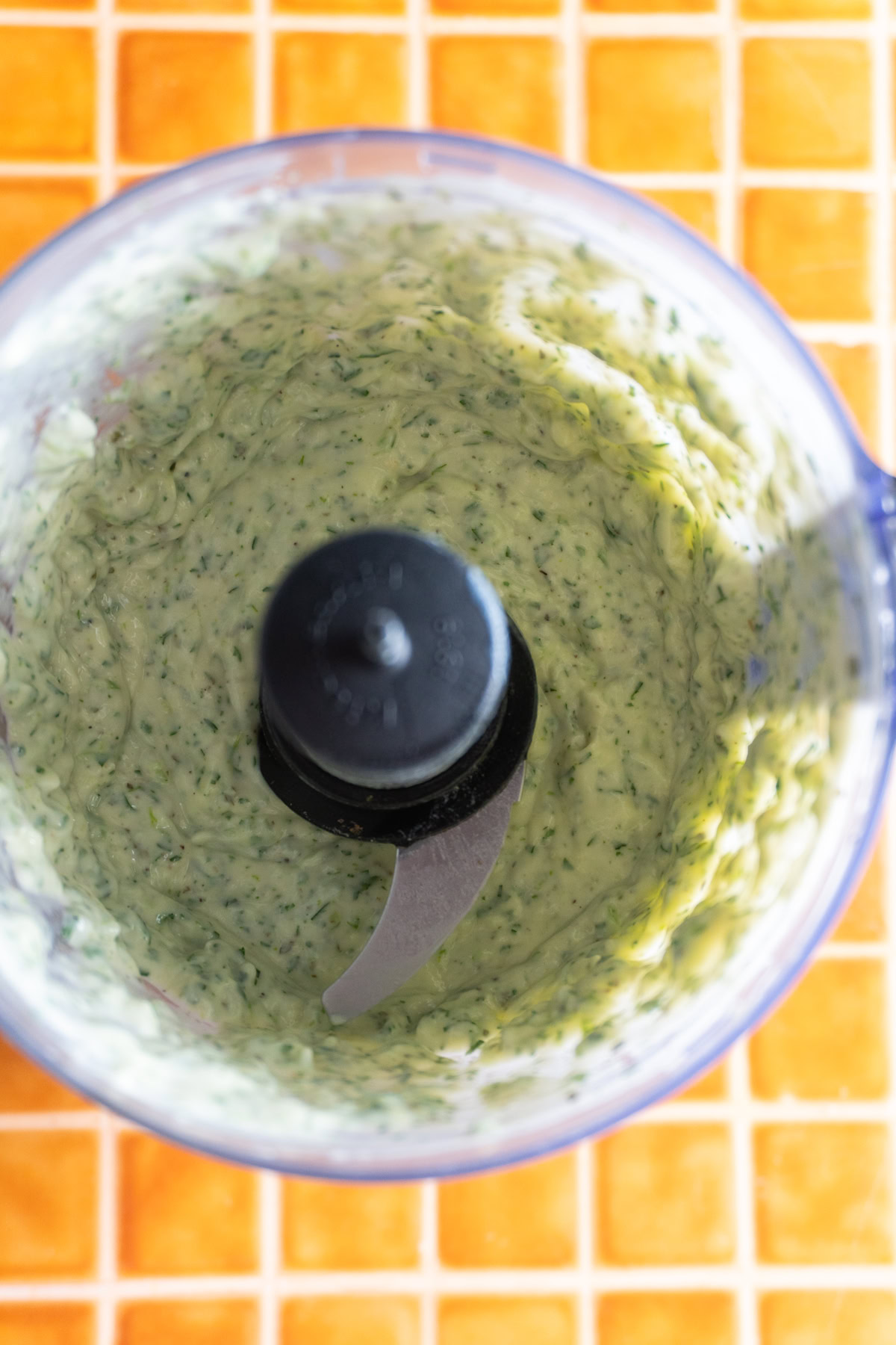 Cilantro ranch in a food processor after mixing.