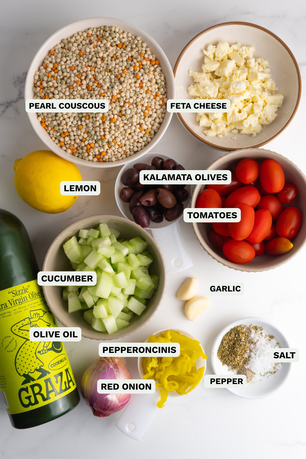 Ingredients needed to make Greek couscous salad.