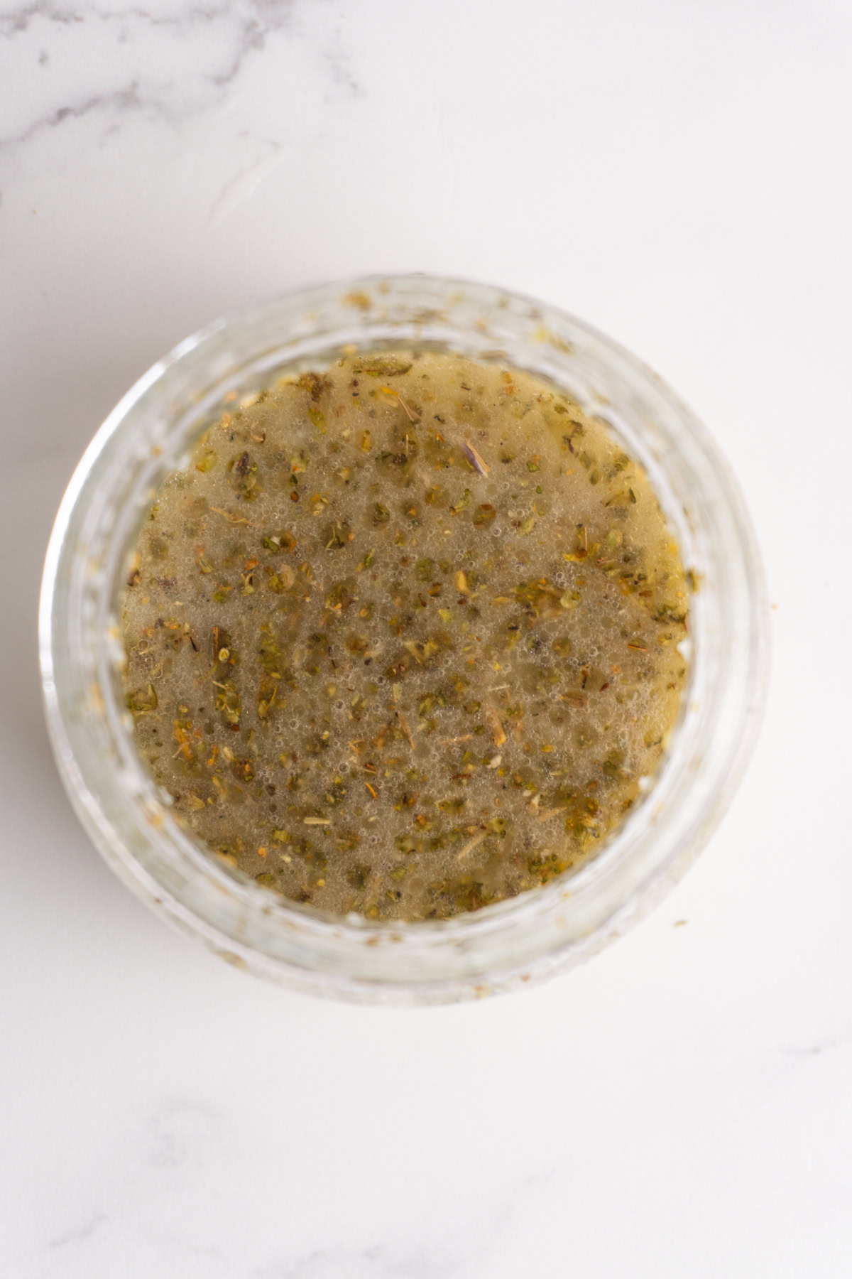 Mixed up salad dressing in a jar.