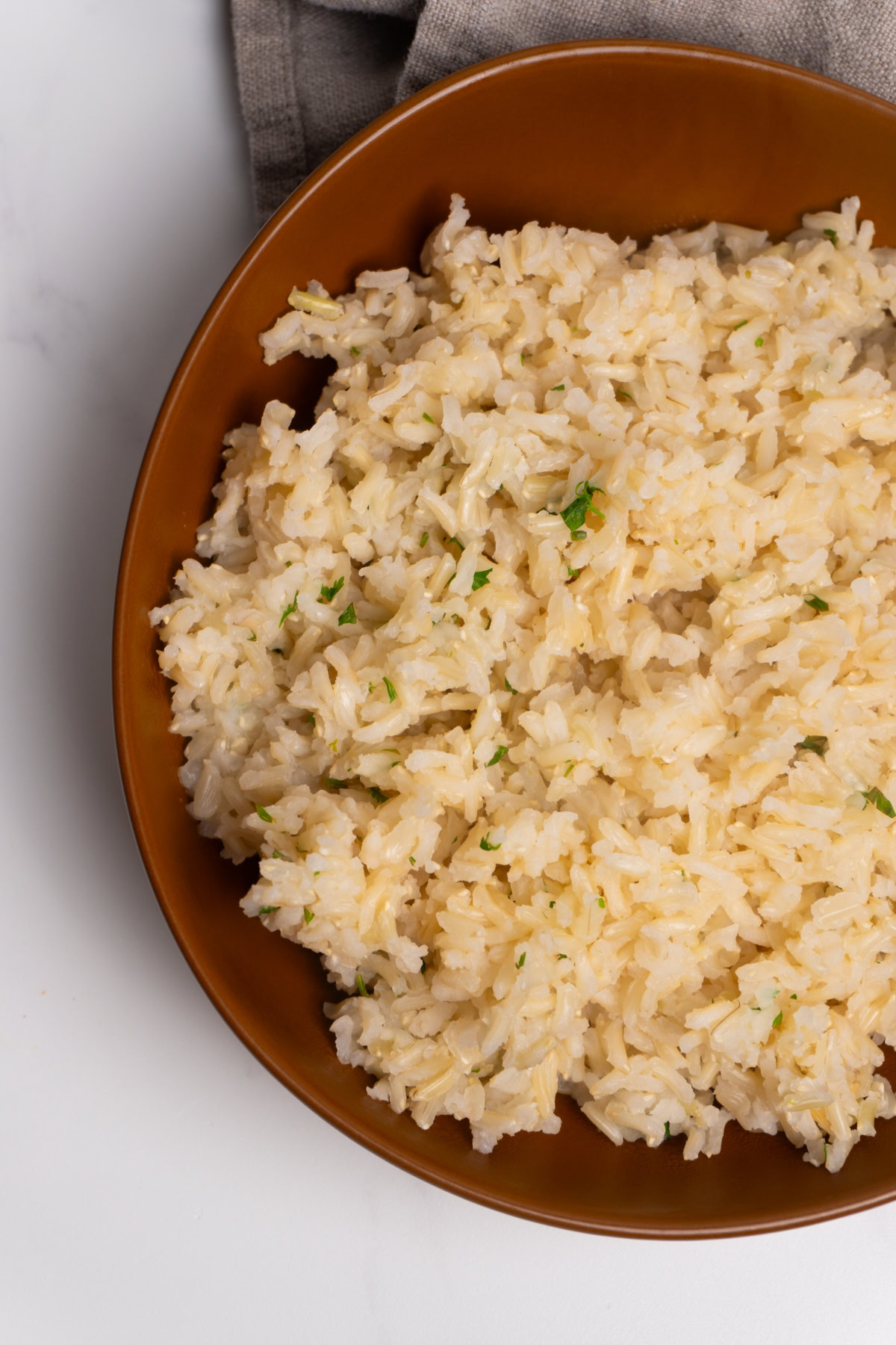 Brown bowl of cilantro lime brown rice.